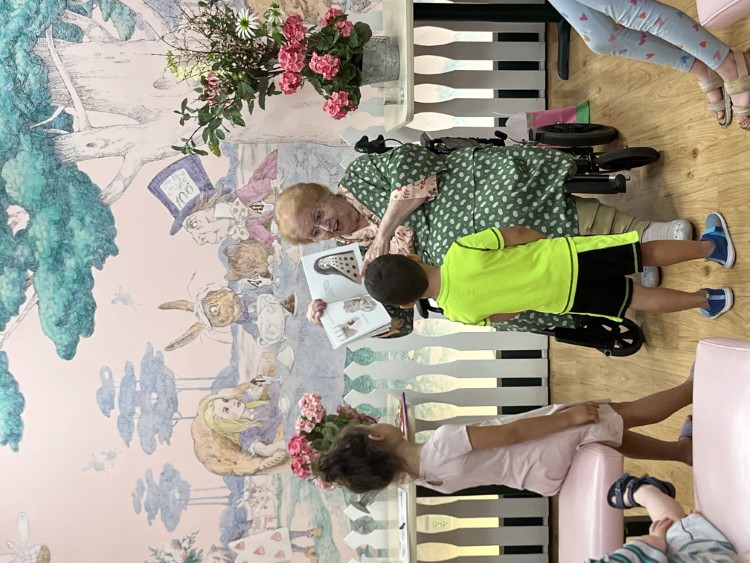 Adele Malley reads to children during  Malley's 2024 summer reading program.